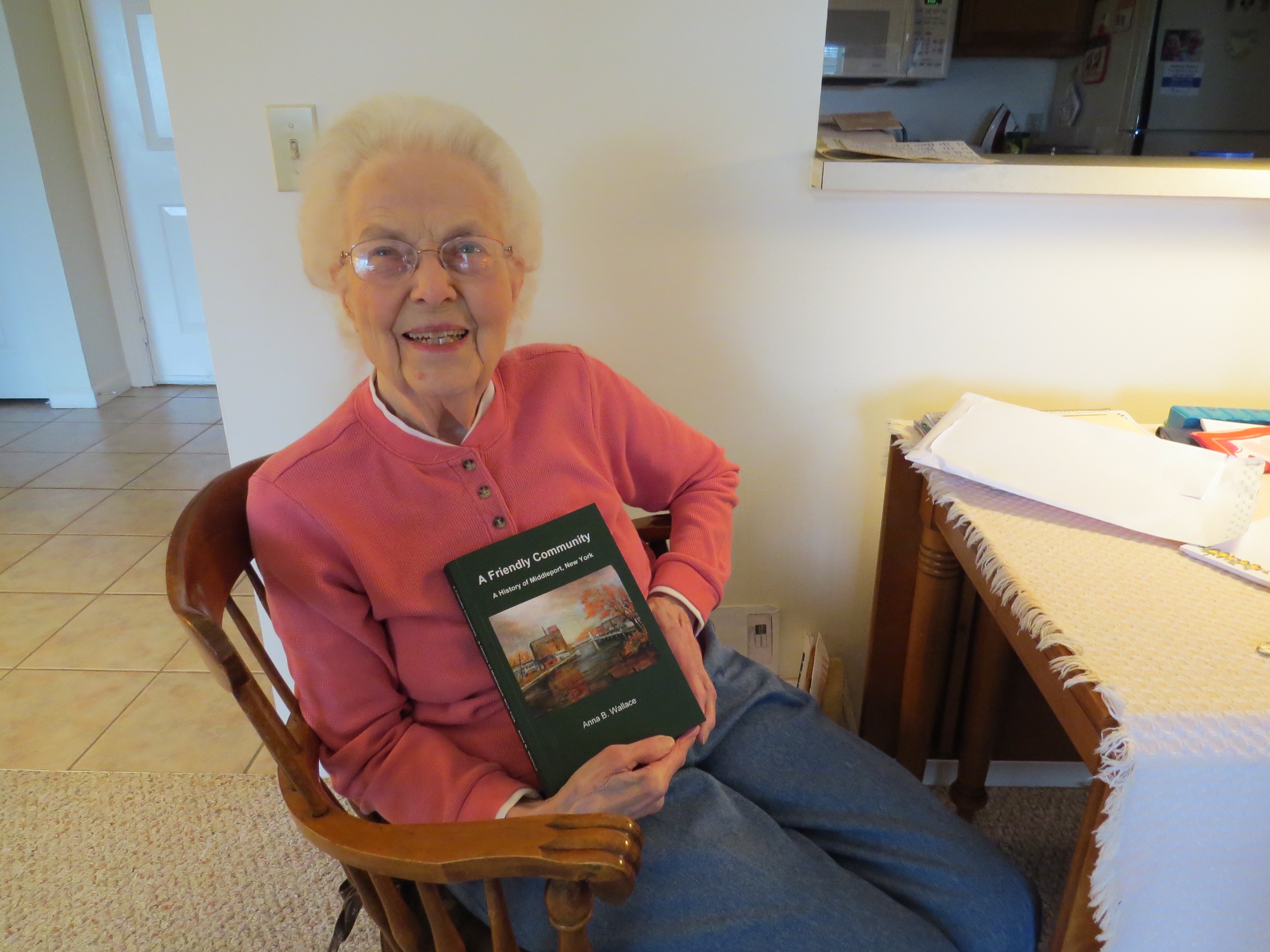 Anna proudly showing her collection of stories about Middleport